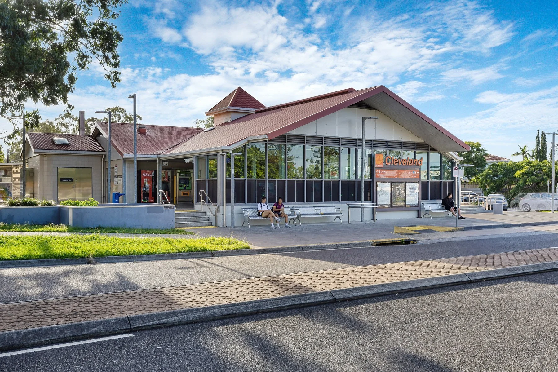 Cleveland Train Station platform and passenger transit infrastructure in Cleveland QLD, highlighting local public transport connectivity and direct commuter rail links to the Brisbane CBD.