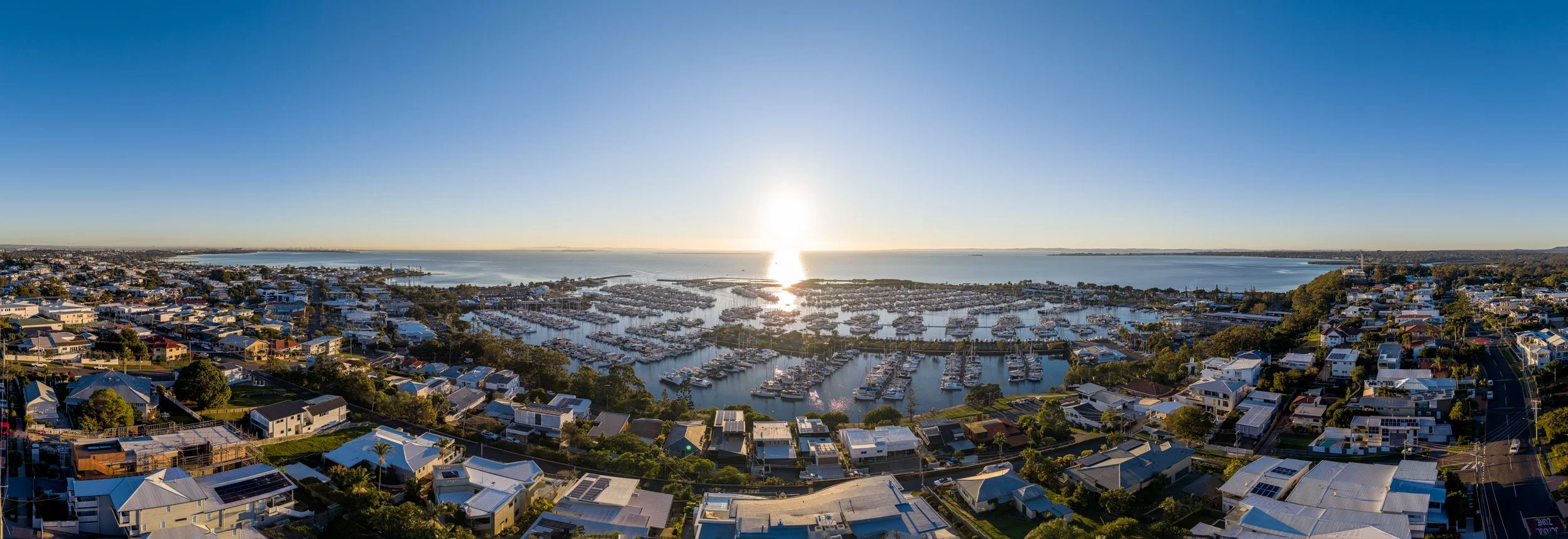 Aerial drone panorama of Manly Boat Harbour and Moreton Bay at sunset — Digital 1 QLD real estate drone photography, Manly QLD 4179