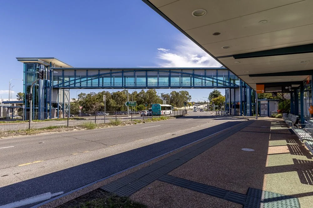 High-connectivity transport infrastructure at the Springwood Bus Station and pedestrian overpass bridge in South East Queensland.