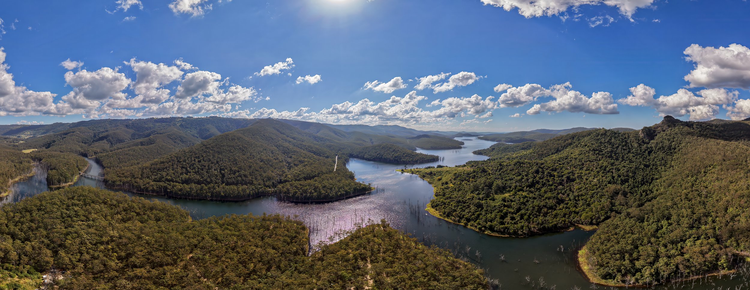 Aerial drone view of Hinze Dam and forested mountains in Advancetown QLD Gold Coast Hinterland