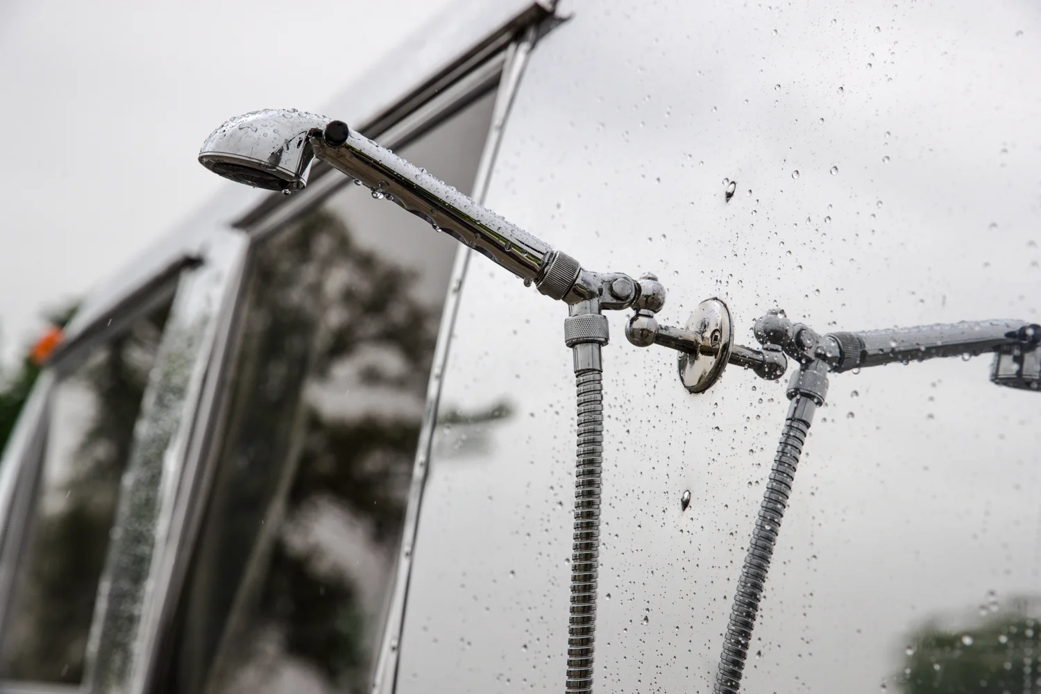 Exterior- retractable exterior shower. Original bracket.