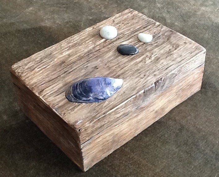 Large box with inset shell and polished beach stones