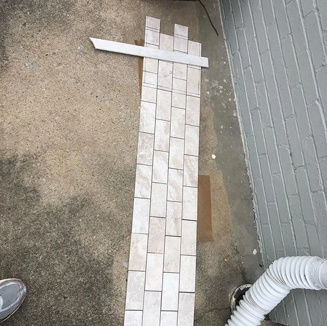 Tiles going up finally!