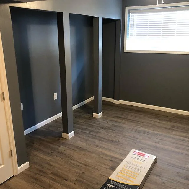 Some of the finishing work of a basement finishing project, a little drywall finishing, some flooring, trim and lots of paint! #vinylplankflooring #paint #trimcarpentry