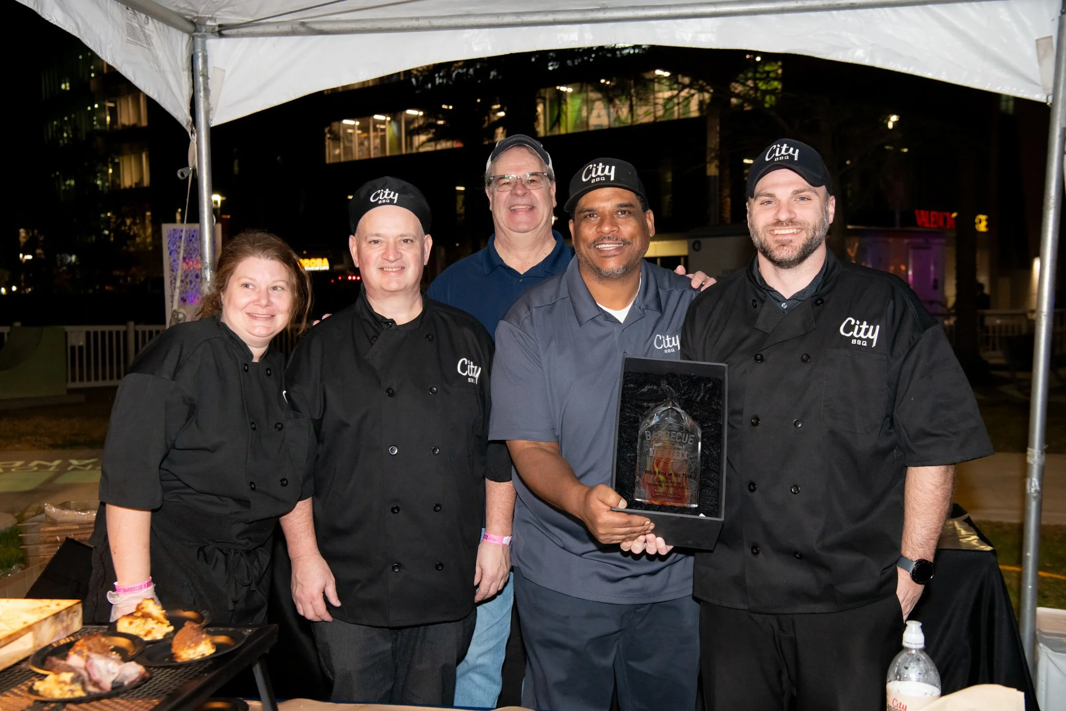 FSP - City Barbeque team photo in tent with trophy2.jpg