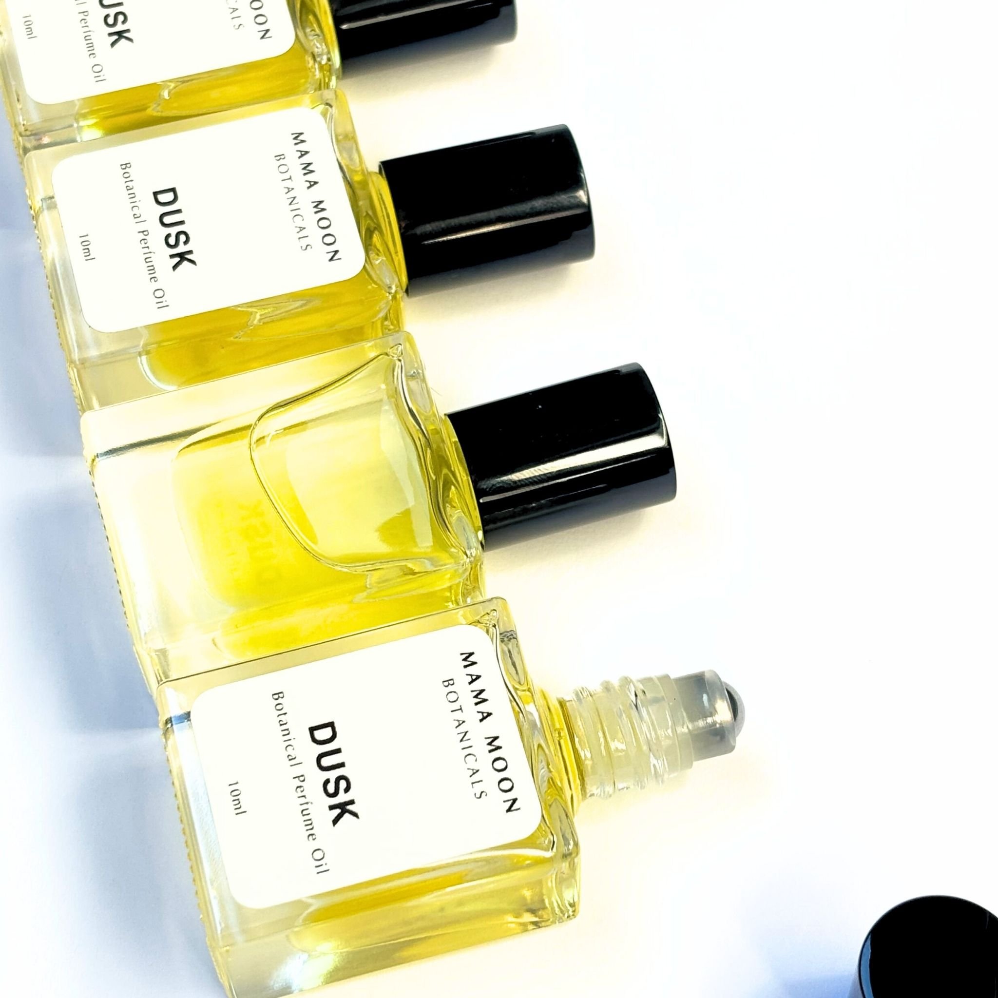 DUSK natural perfume oil with amber, spice, and botanical musk.jpg