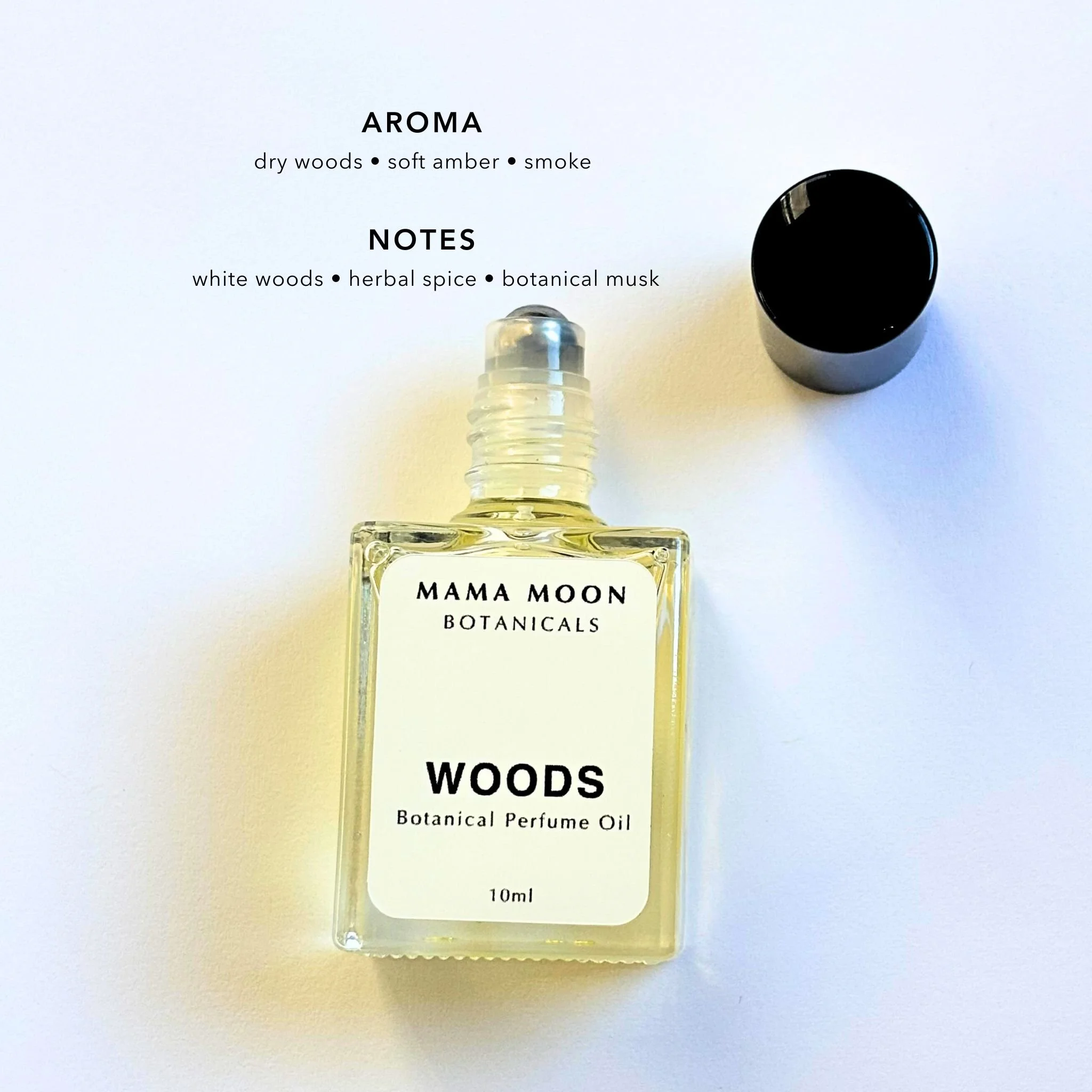 WOODS botanical perfume oil with woody resins, spice, and incense notes