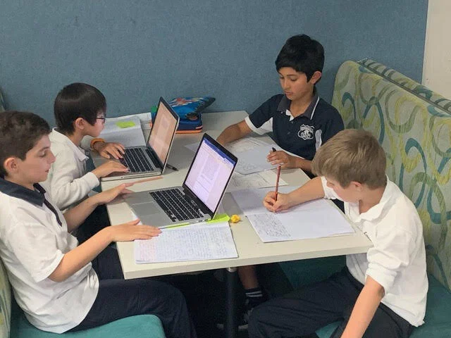 Young boys learning to become master writers together at Inkling’s face-to-face Term 3 school classes.