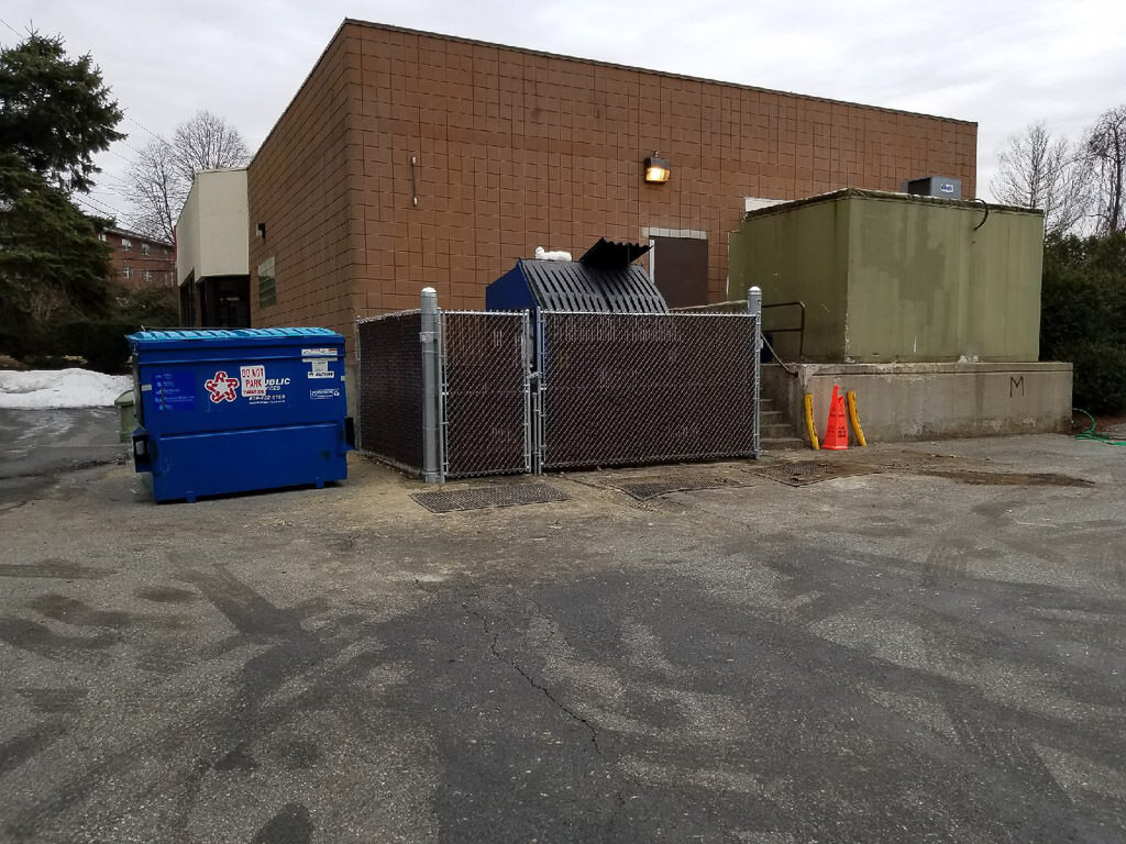 chain link dumpster enclosure in Waltham