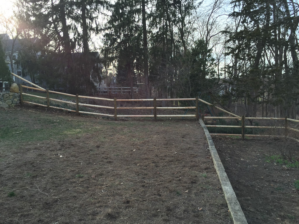 round post and rail fence in Weston