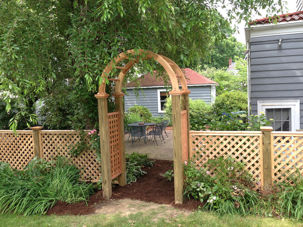 arbor with lattice fence in Newtonville