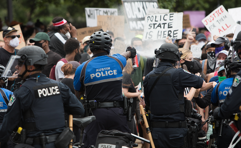 Police make arrests during a protest in Austin. Image Credit: Ben Carneiro