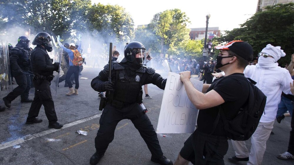 Seattle Police use smoke bombs and pepper spray against protesters. Image Credit: realtalktime.com