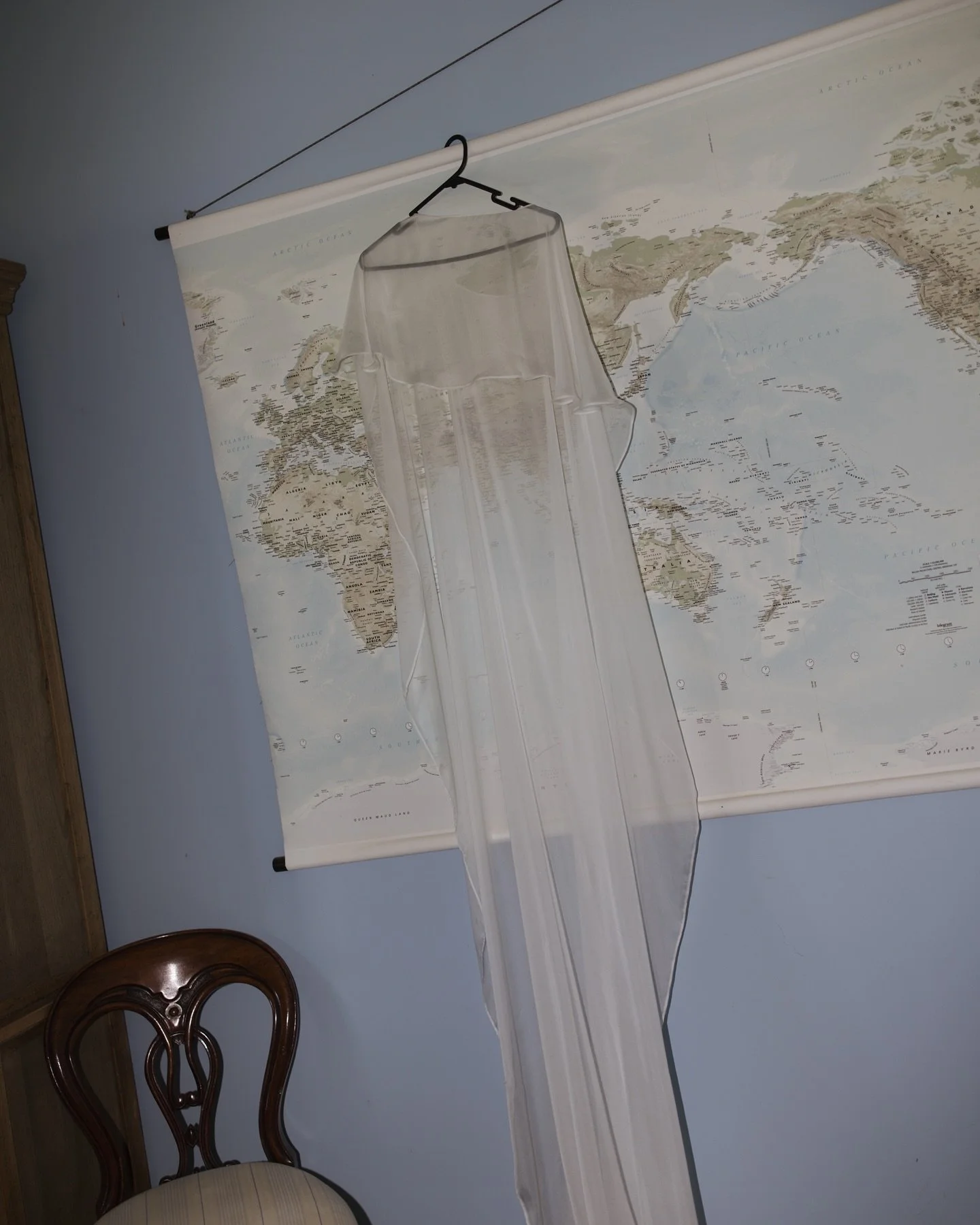 A special garment hanging in her parents&rsquo; lounge &mdash; not just fabric and thread, but a symbol of love and dreams about to unfold. The soft overlay shimmers faintly like it knows its moment is coming. Perfectly designed by the fairy godmothe