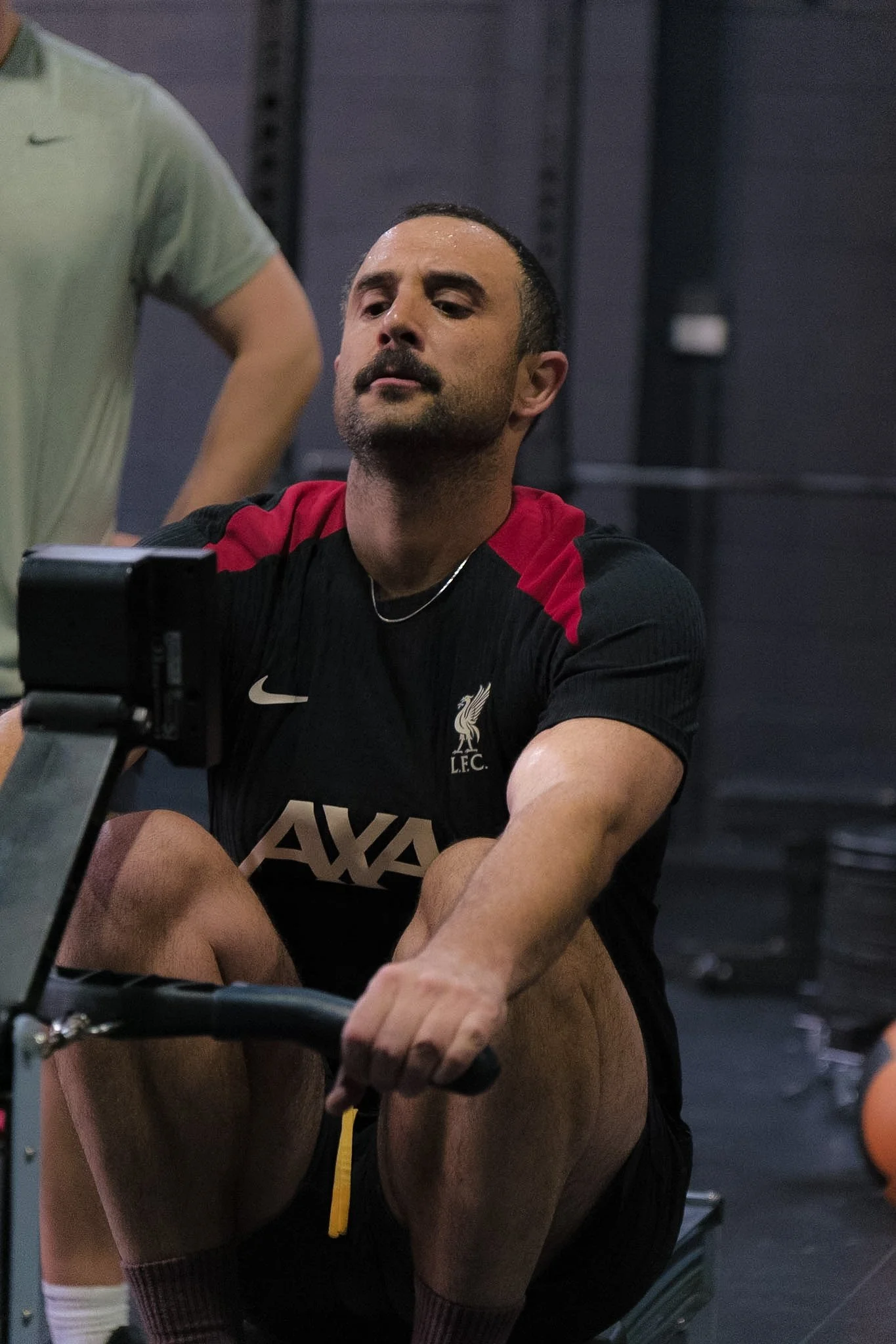 A man on a rowing machine during a workout