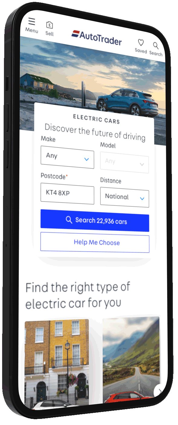 Smartphone screen displaying AutoTrader website with a search filter for electric cars, showing a blue vehicle parked by a beach at sunset, and images of a house and a mountain road below.
