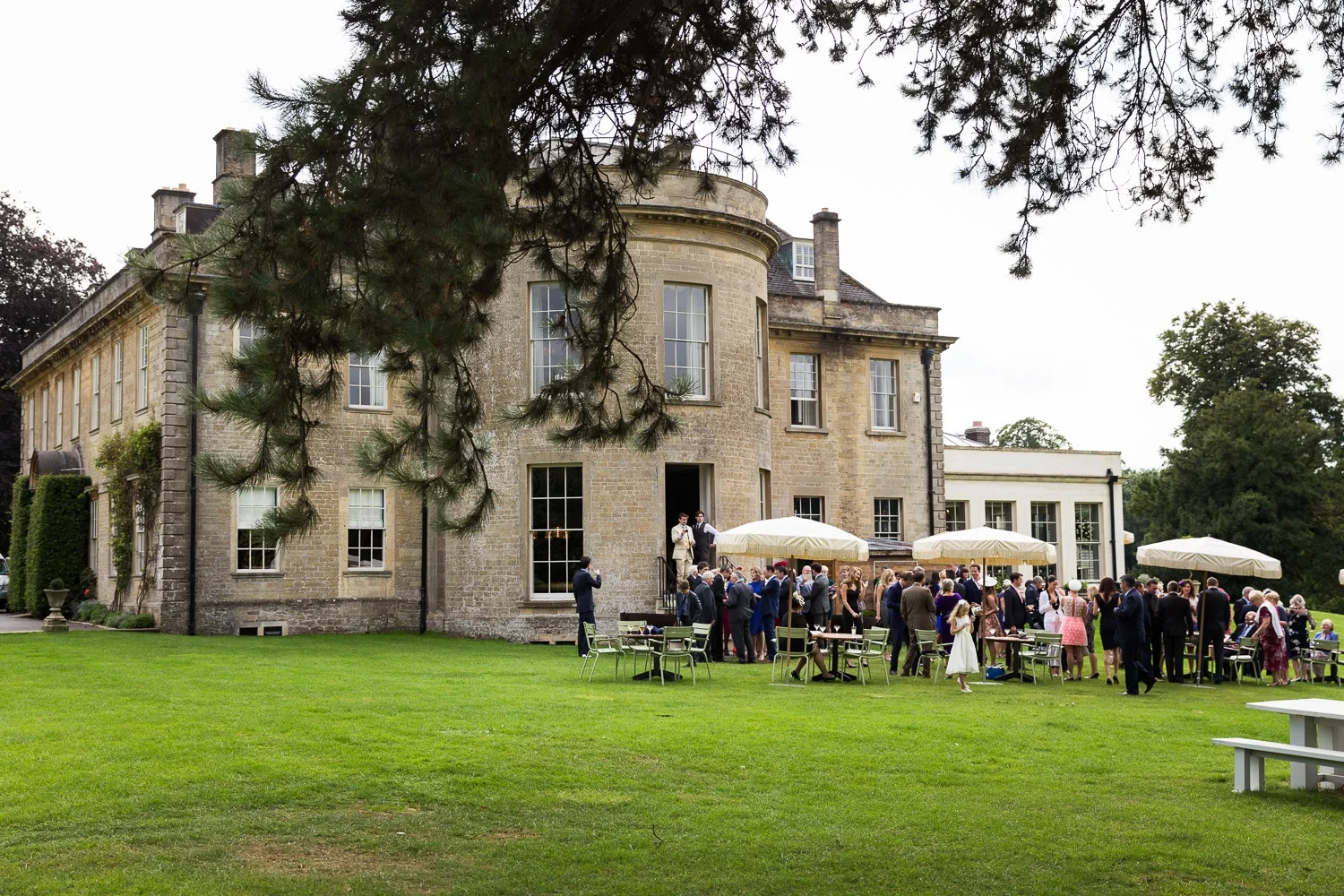 Wedding guests enjoying the outdoor space at babington house