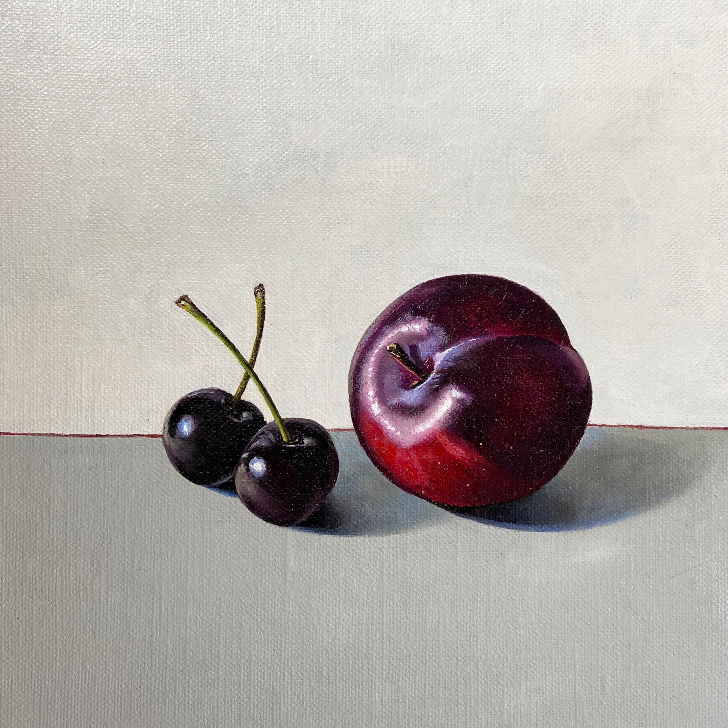 Plum with two black cherries