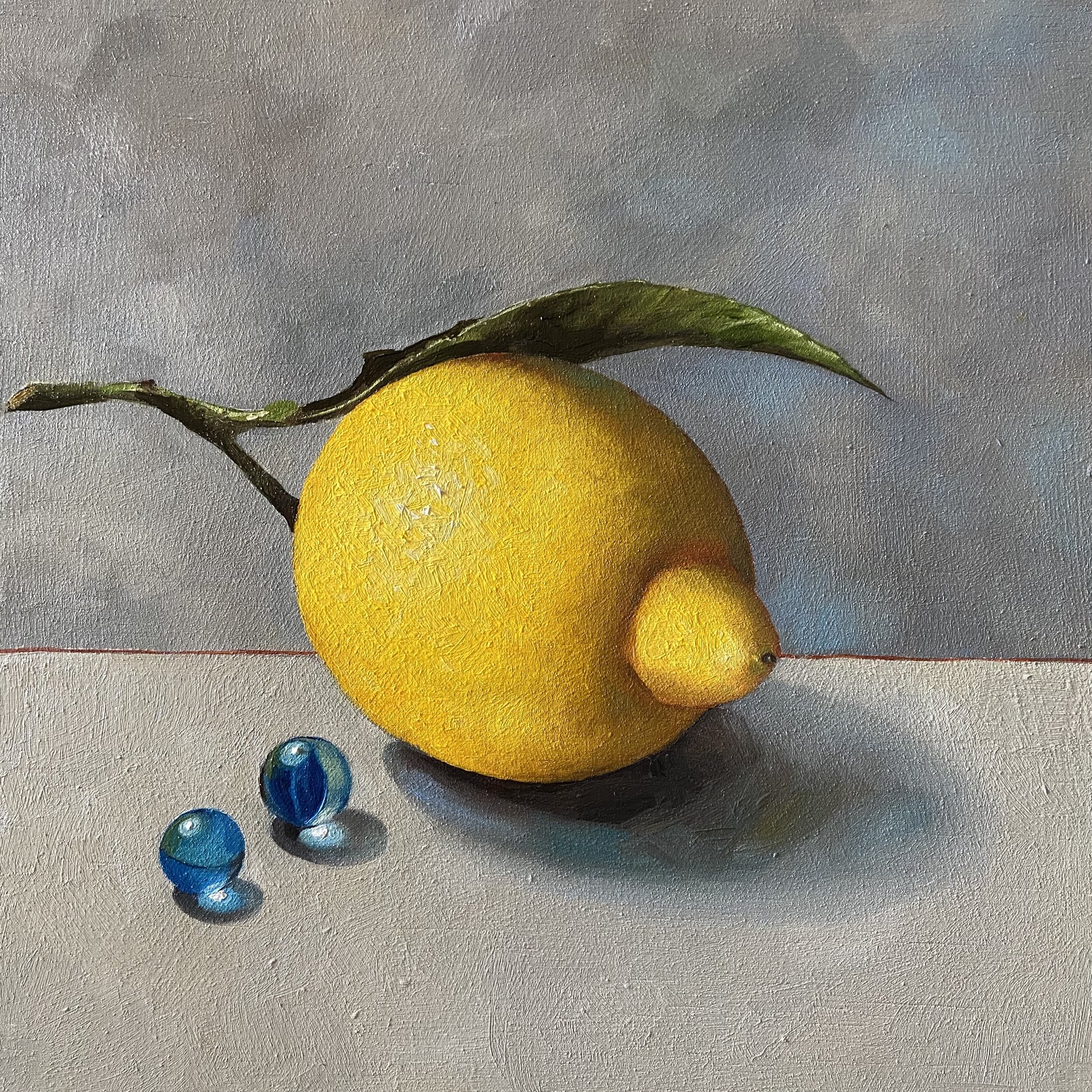 Leafy lemon with blue marbles