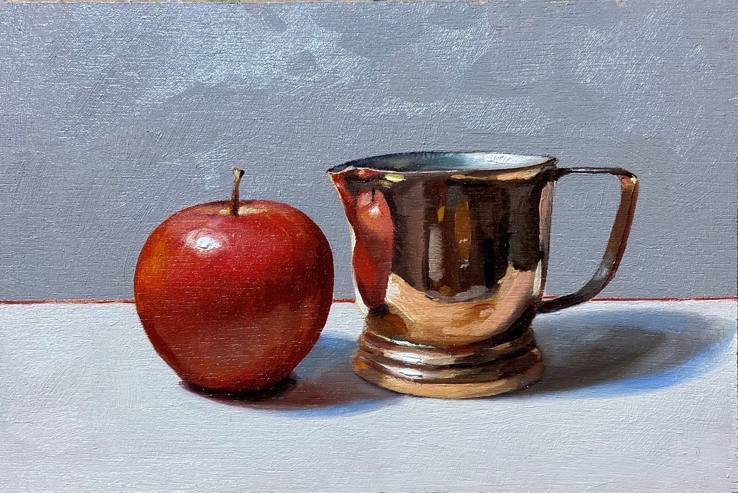 Red apple with copper jug