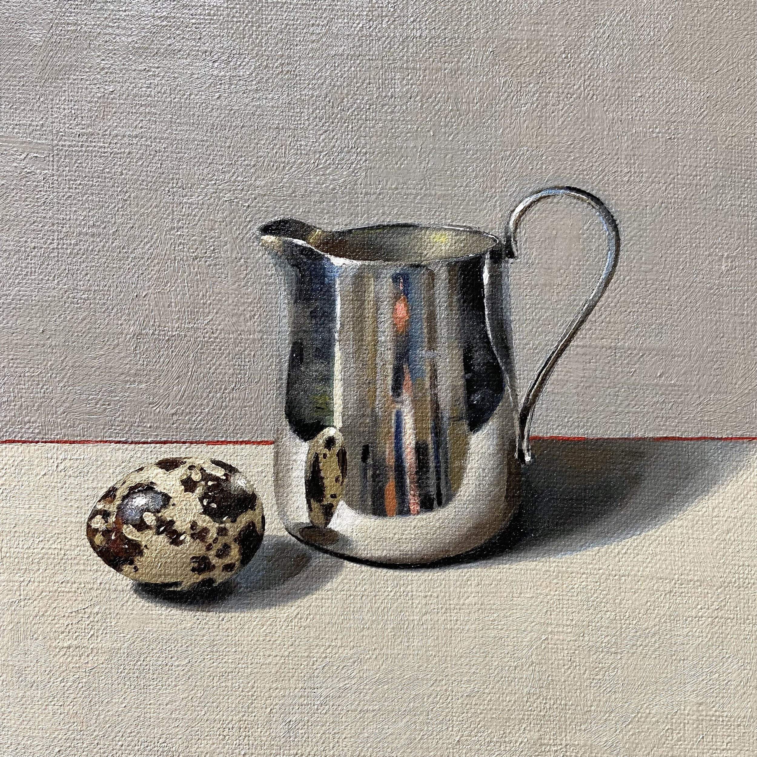 Silver jug with quail egg