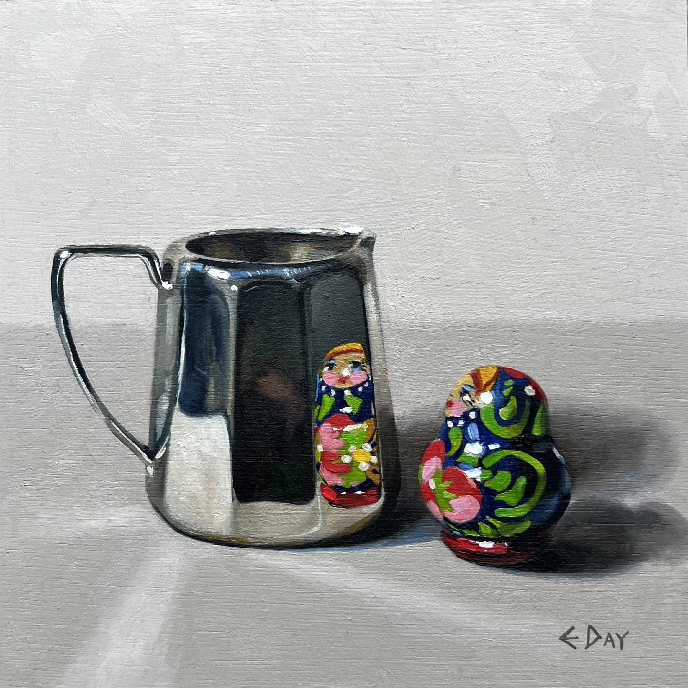 Silver jug with mini Matryoshka doll