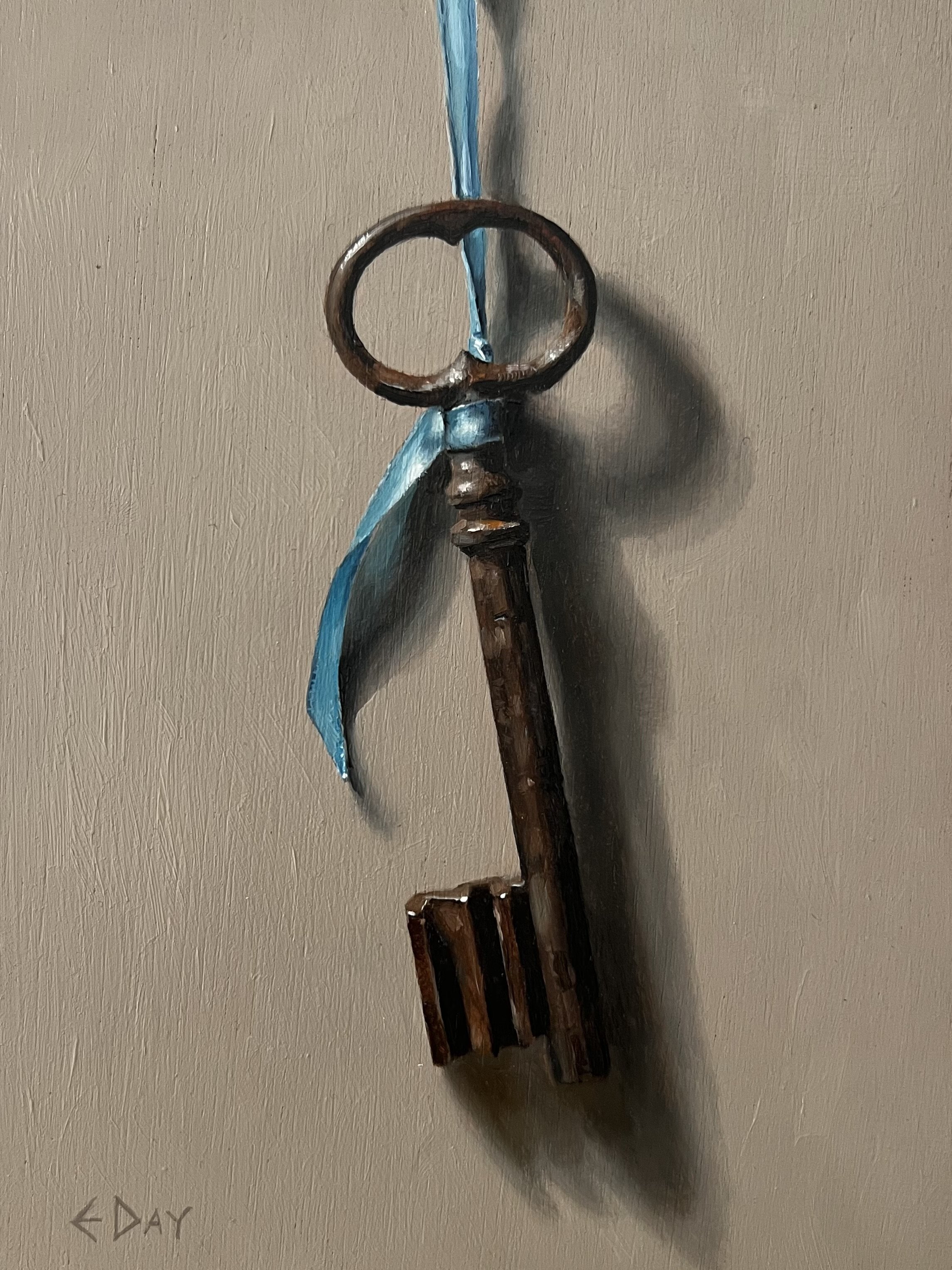 Old French key with blue ribbon