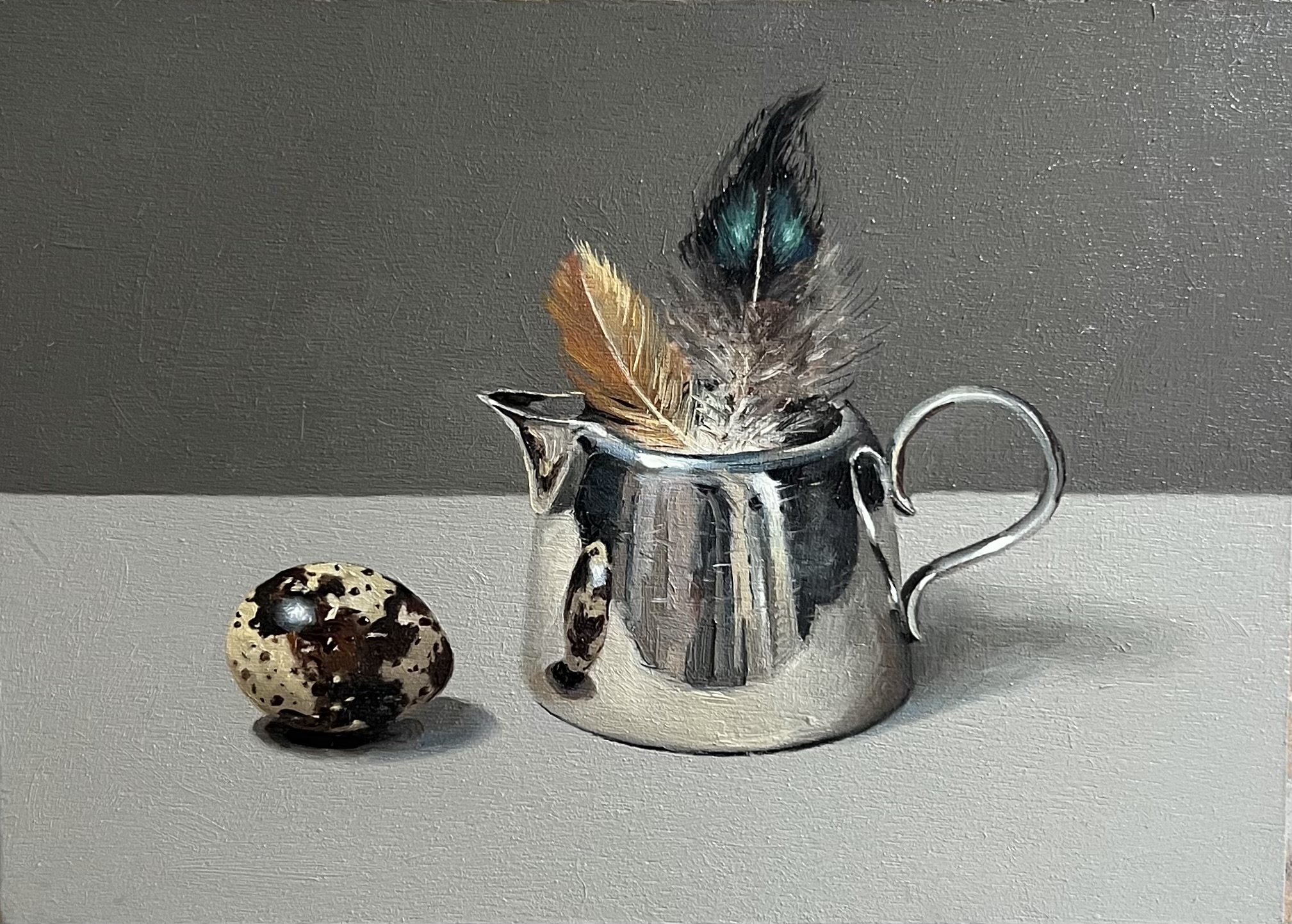 Quail egg, quail feathers and silver jug