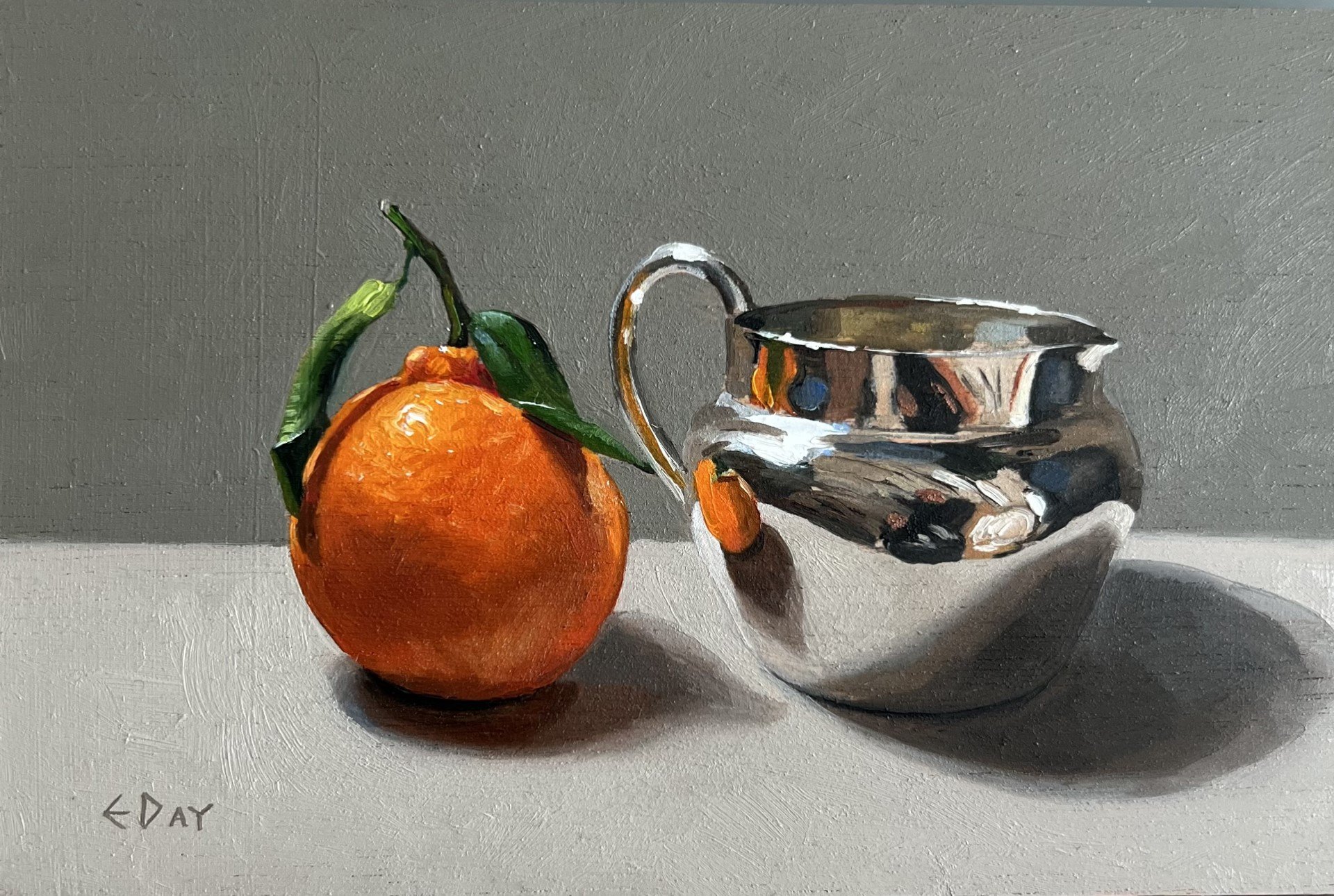 Leafy clementine with silver jug