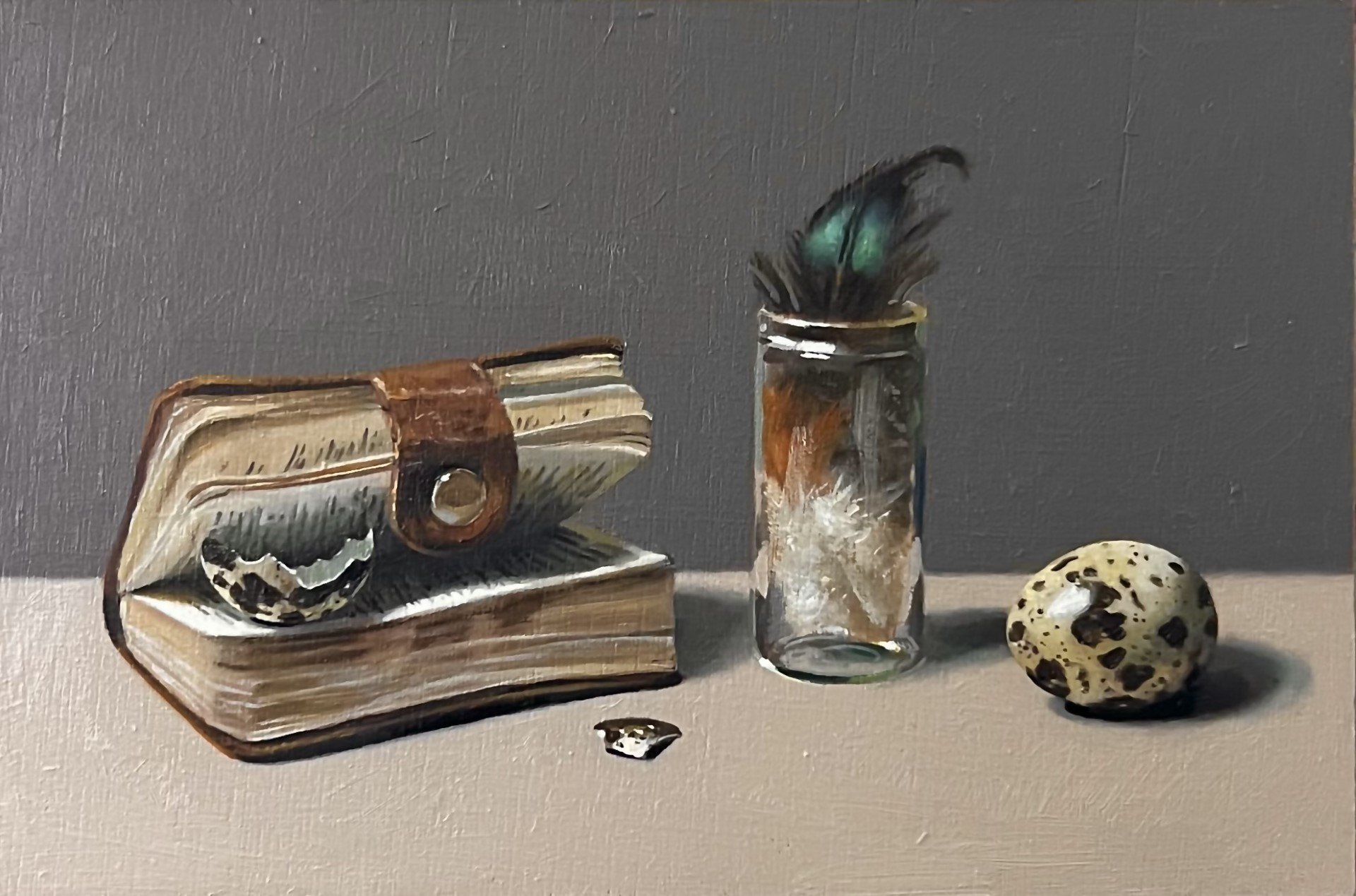 Feathers and quail eggs with book