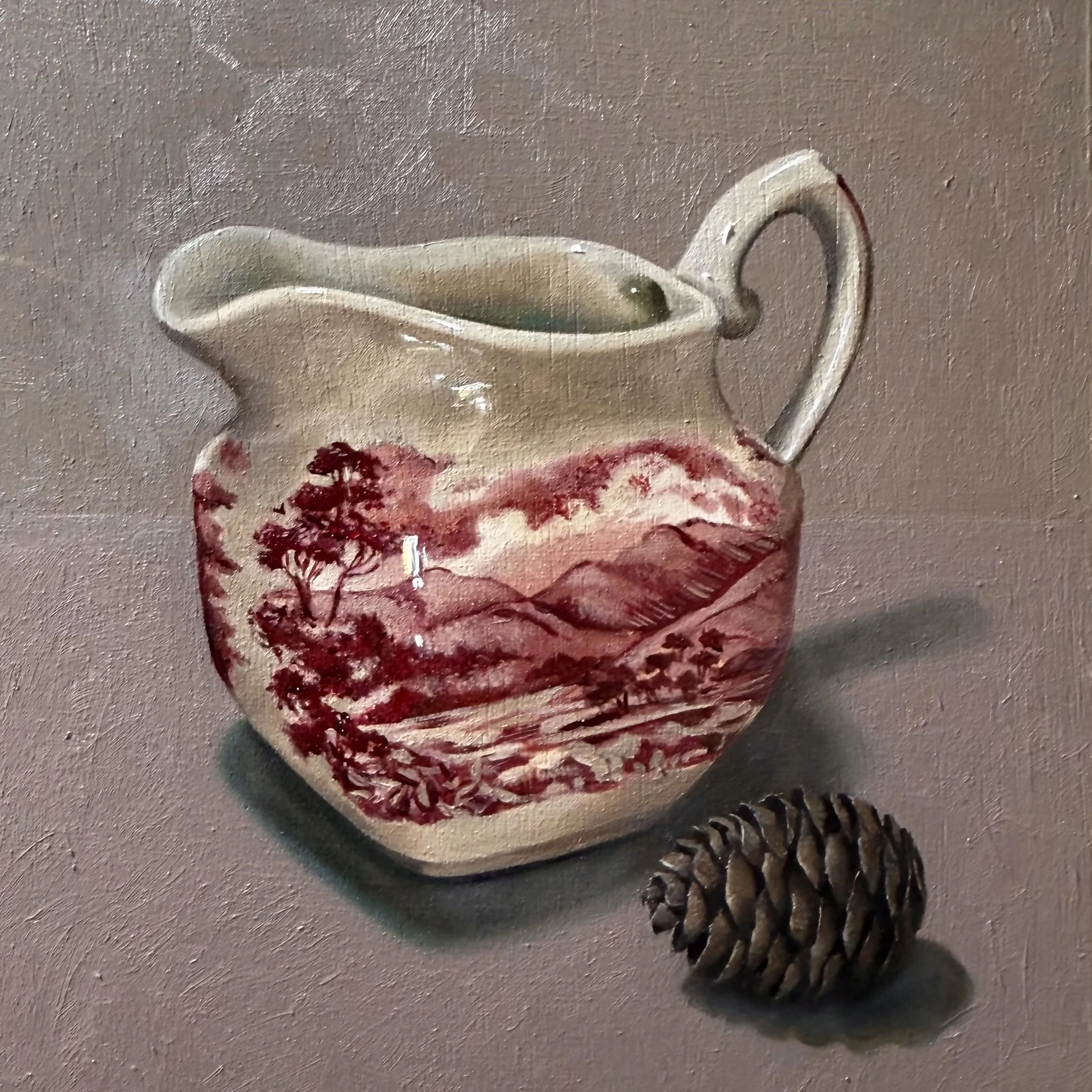Staffordshire milk jug with pine cone