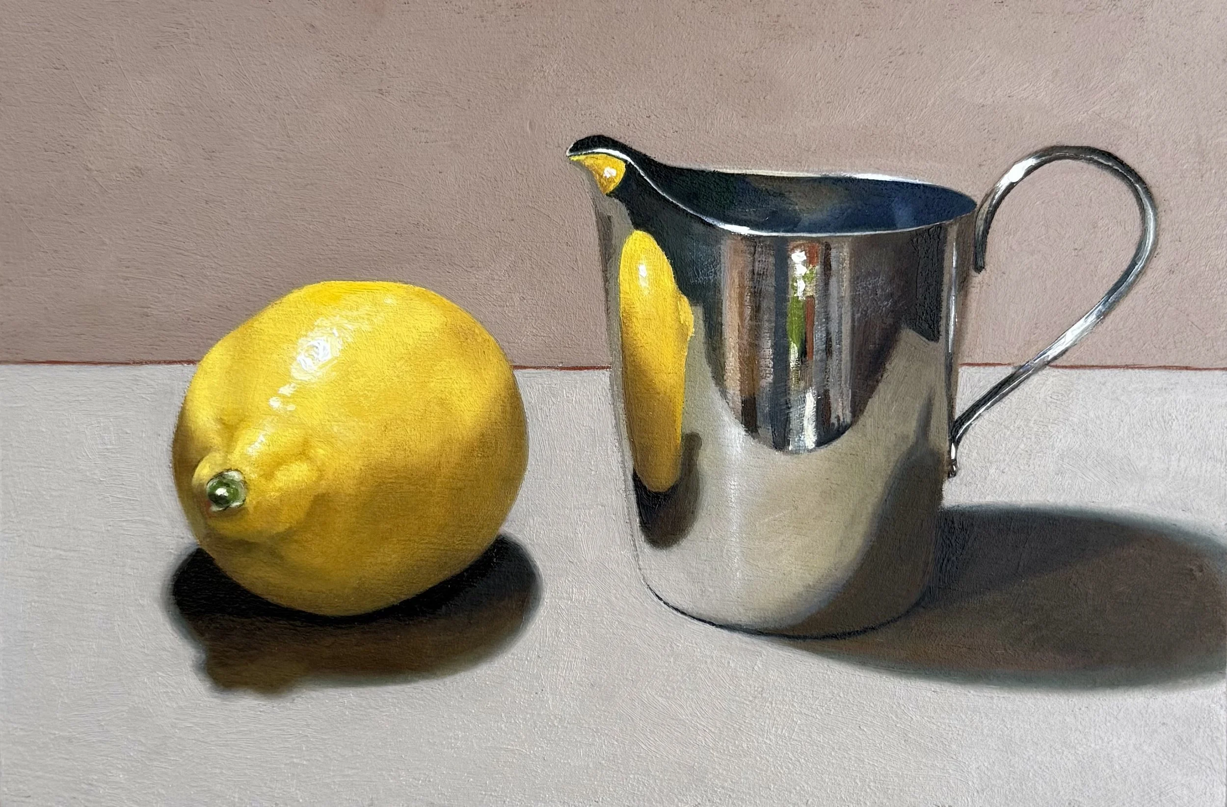 Silver jug with lemon