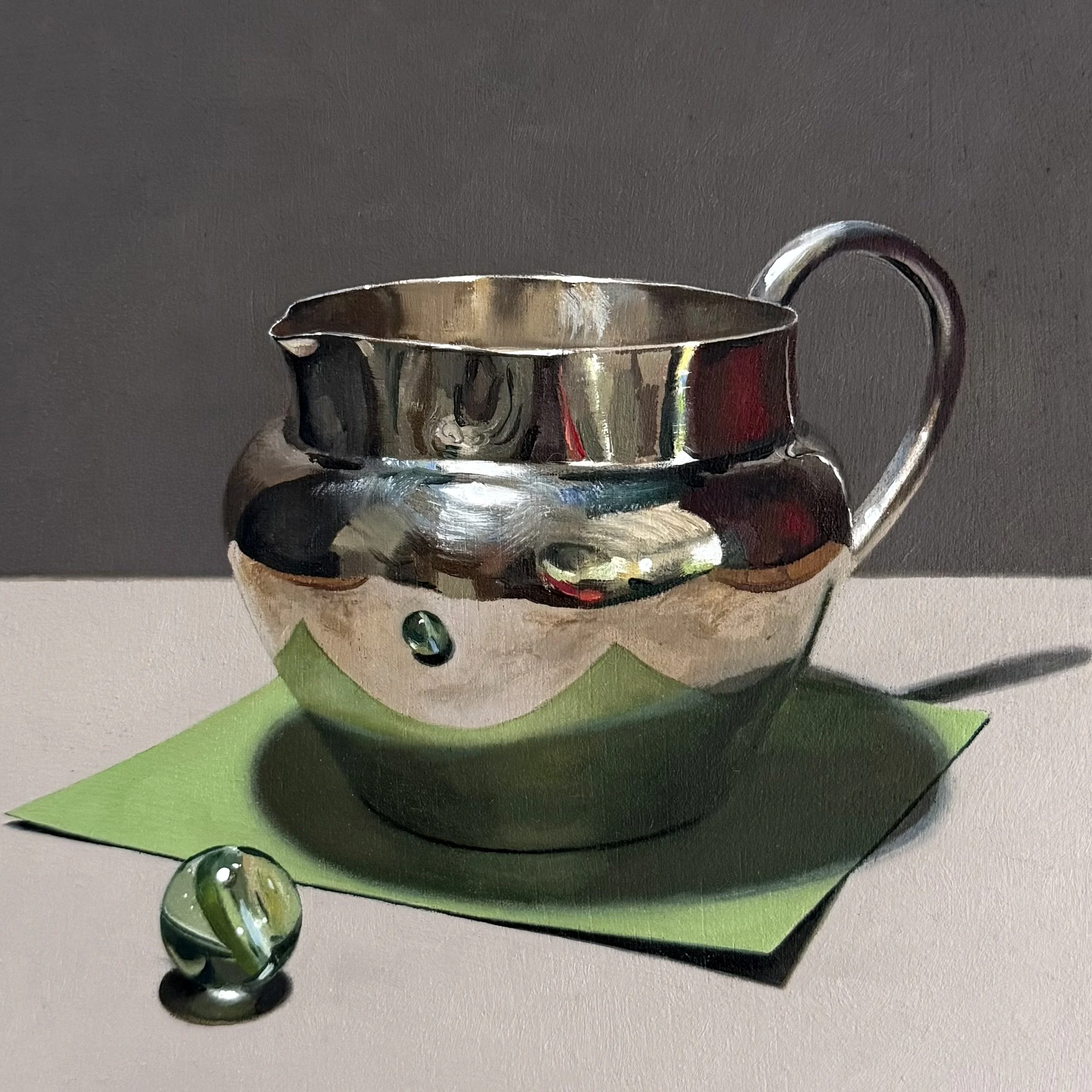 Silver jug with green