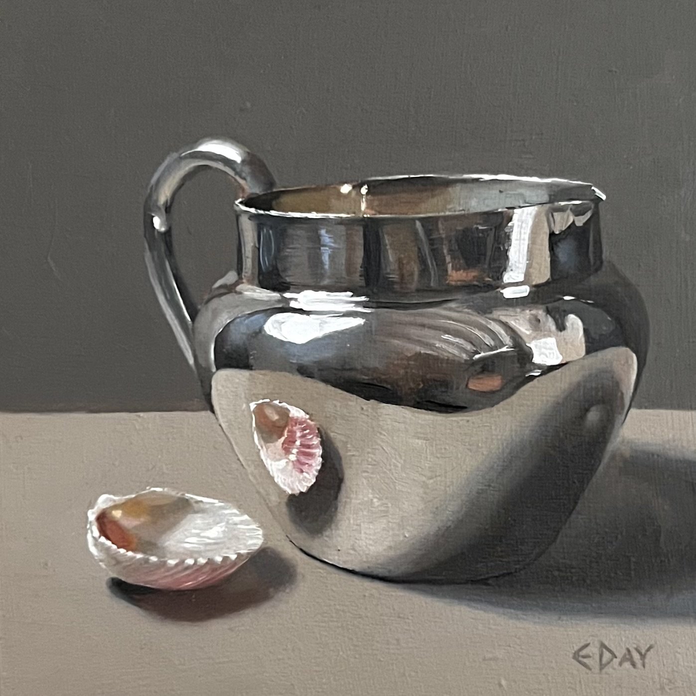 Silver jug with seashell