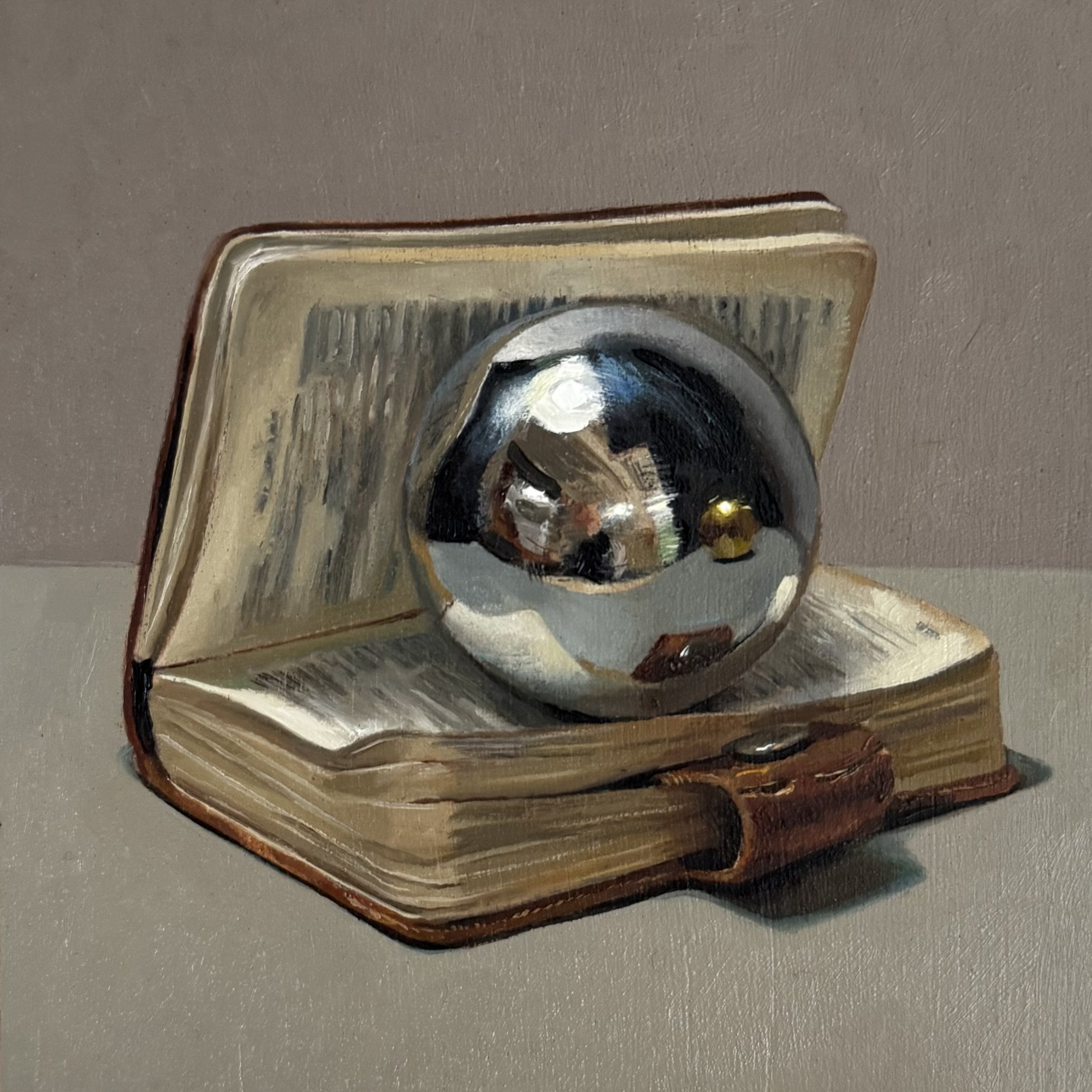 Silver ball with little book