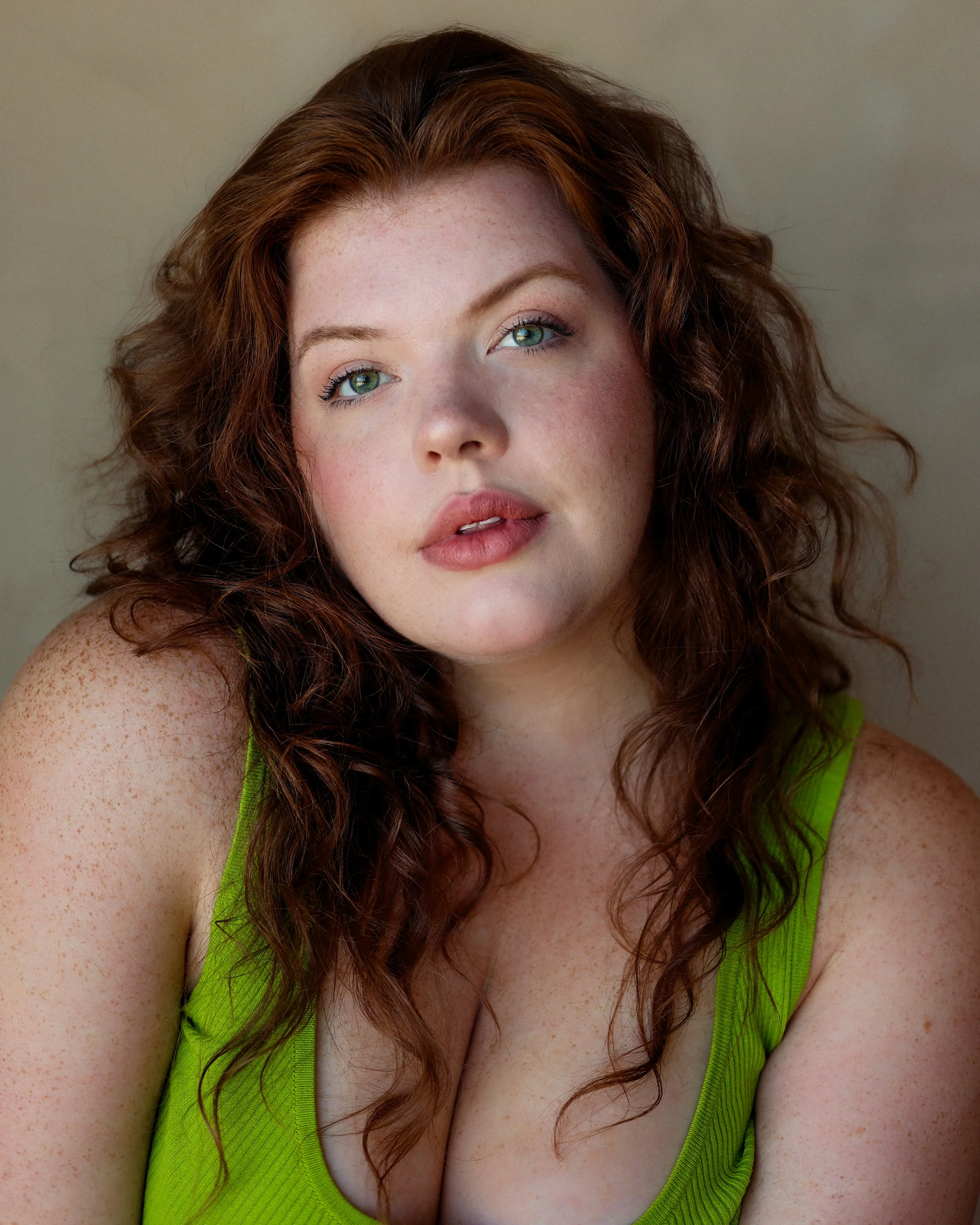 Headshot of Broadway Actor Shelby Griswold, a 20s-30s woman with red hair and green eyes