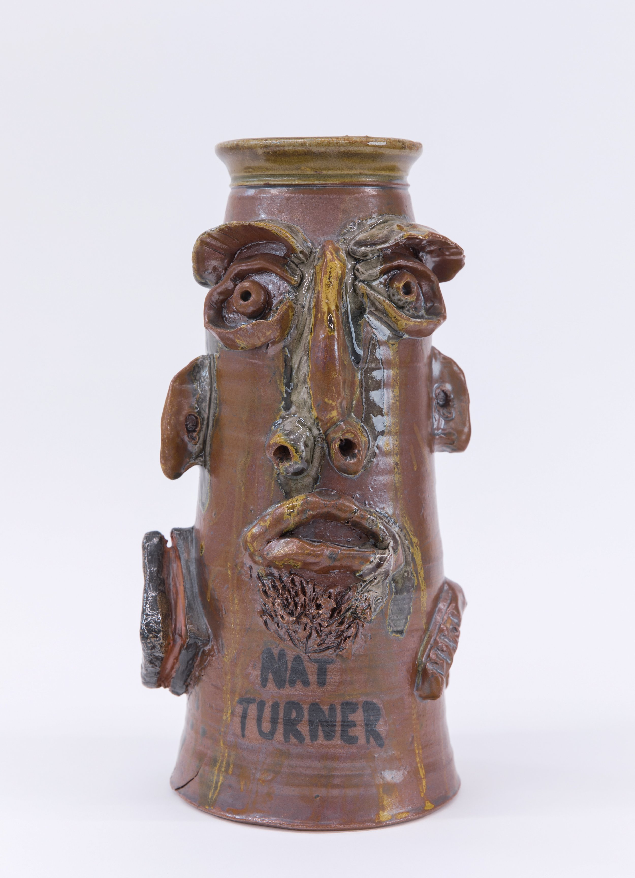 JIM MCDOWELL Nat Turner Freedom Fighter , 2021 high fire clay, glass, Jack Troy root beer glaze, fired in a gas kiln with salt and soda 14.25 x 7 inches INQUIRE+