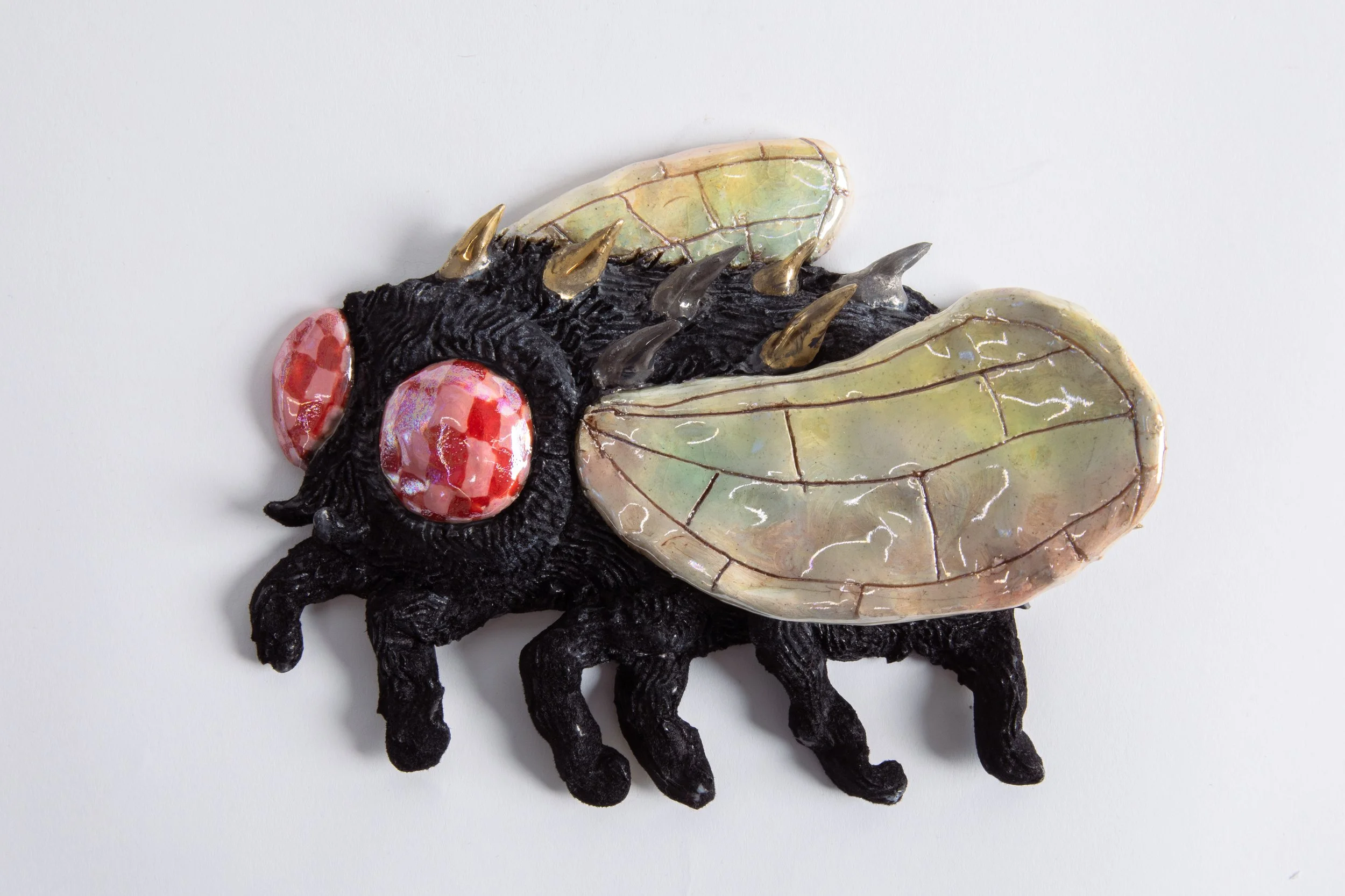  GRACE STOTT  Fly guy 4 , 2025 stoneware, gold, adhesive, flock fibers 6 x 8 x 2.5 inches   INQUIRE+  