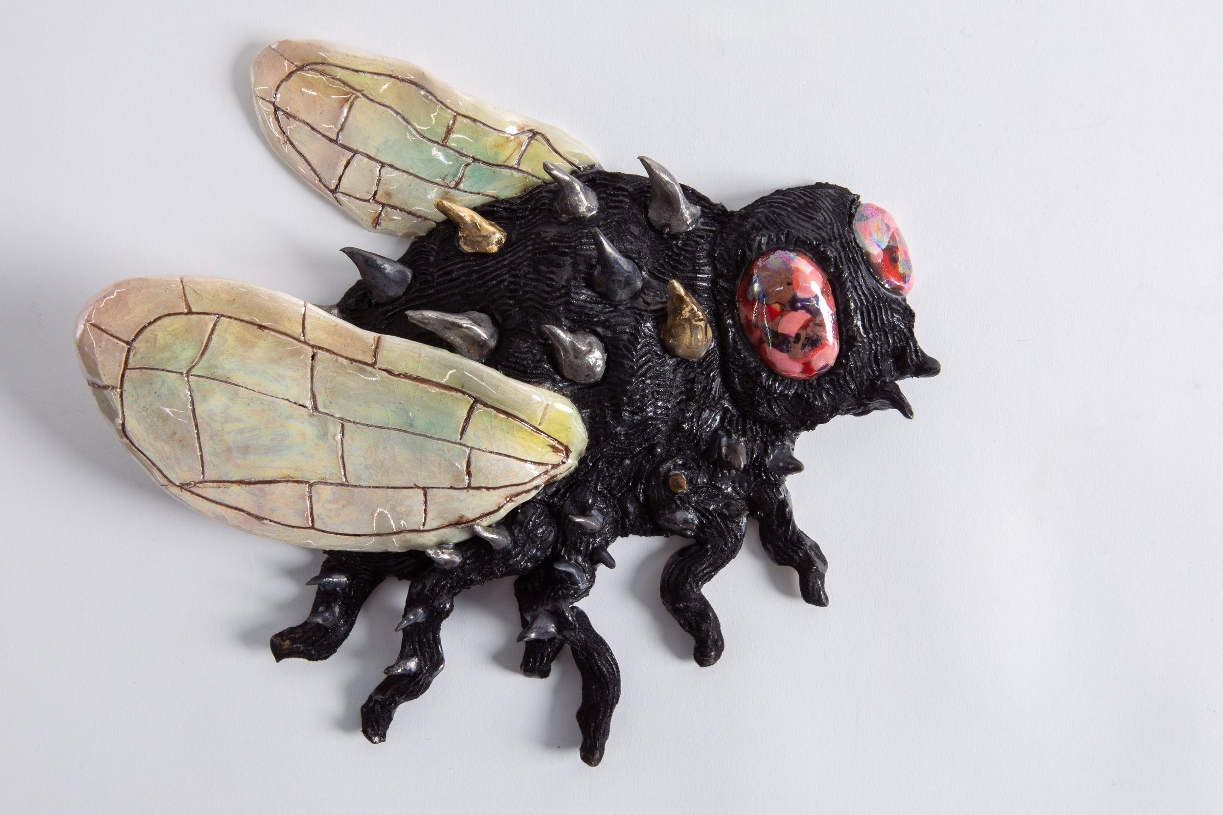  GRACE STOTT  Fly guy 3 , 2025 stoneware, gold, adhesive, flock fibers 9 x 9.75 x 1.75 inches   INQUIRE+  