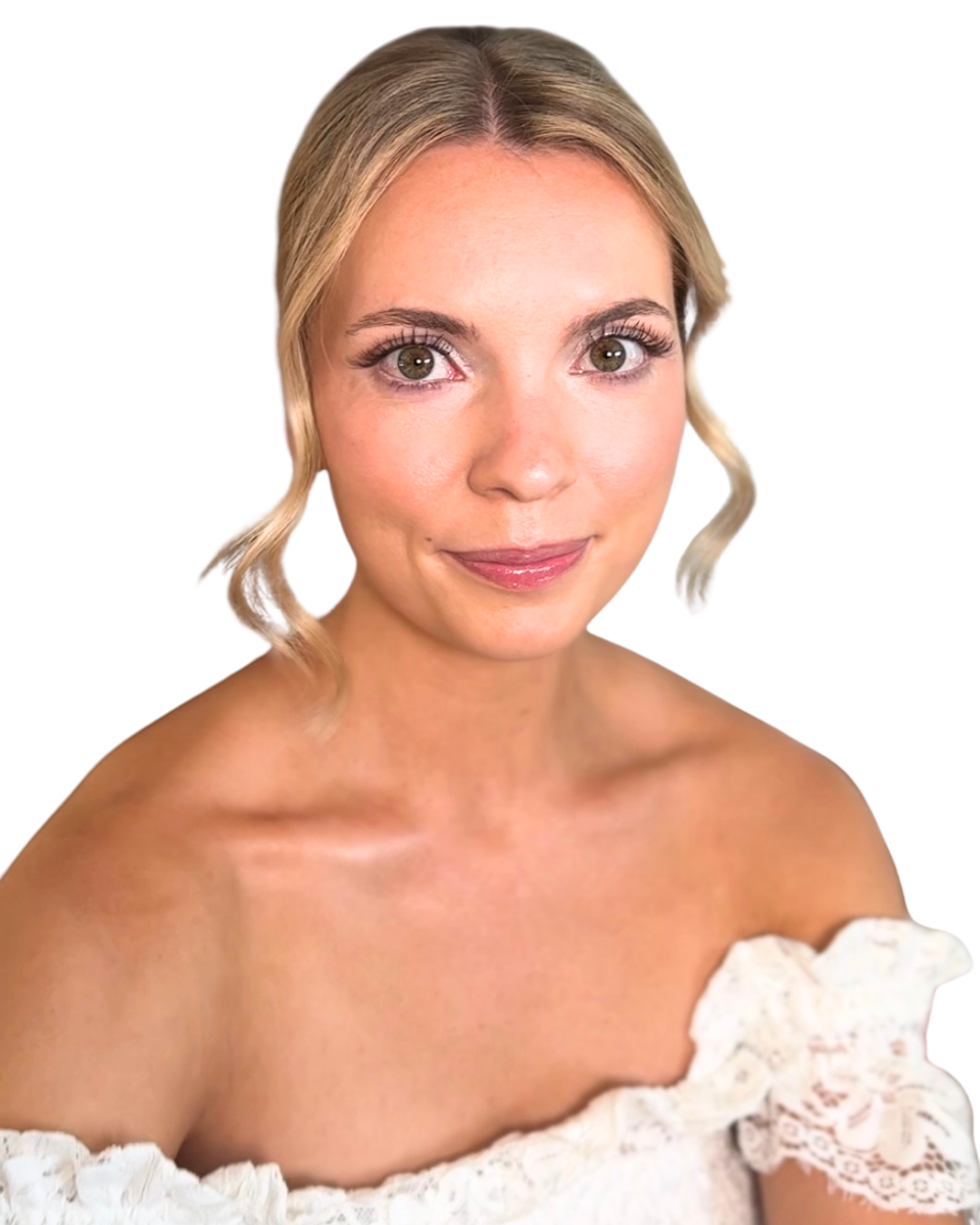 A woman with blonde hair styled in loose waves, wearing an off-shoulder white lace top, smiling softly with makeup emphasizing her eyes.