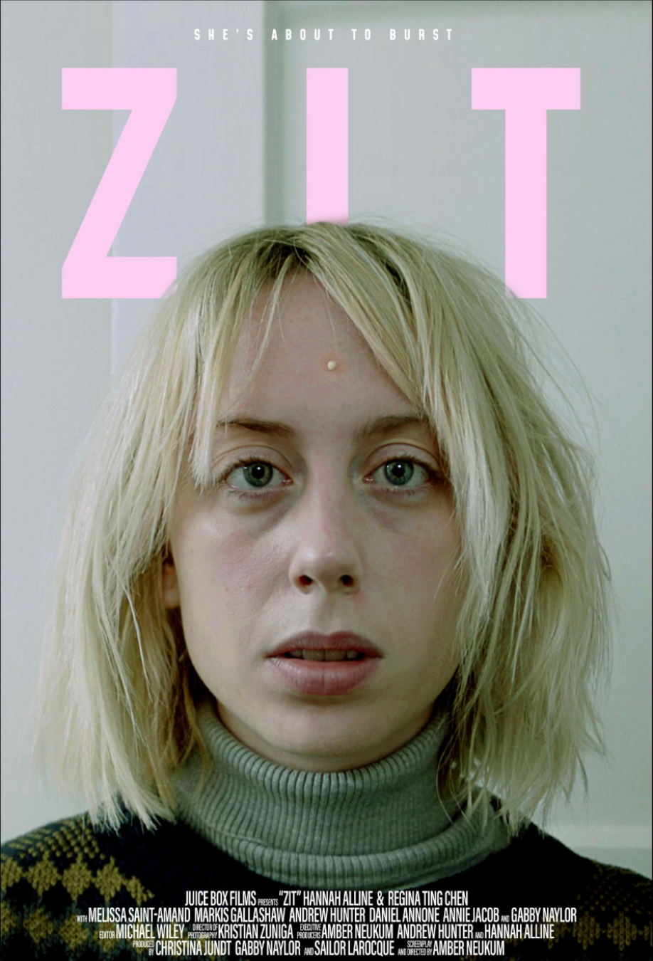 A close-up portrait of a woman with short blonde hair, green eyes, and a neutral expression, with the title 'ZIT' in large pink letters and the tagline 'She's about to burst' at the top.