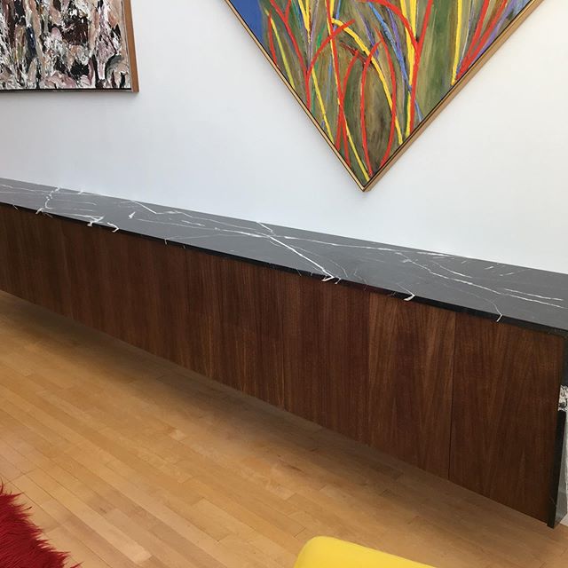 Custom wall mounted credenza in walnut and Nero Marquina marble. 13&rsquo;6&rdquo; long. 2 banks of Interior drawers. a great project for an amazing long-time client. #customfurniture #canadiandesign #customdesign #credenza #neromarquina #madedesign 