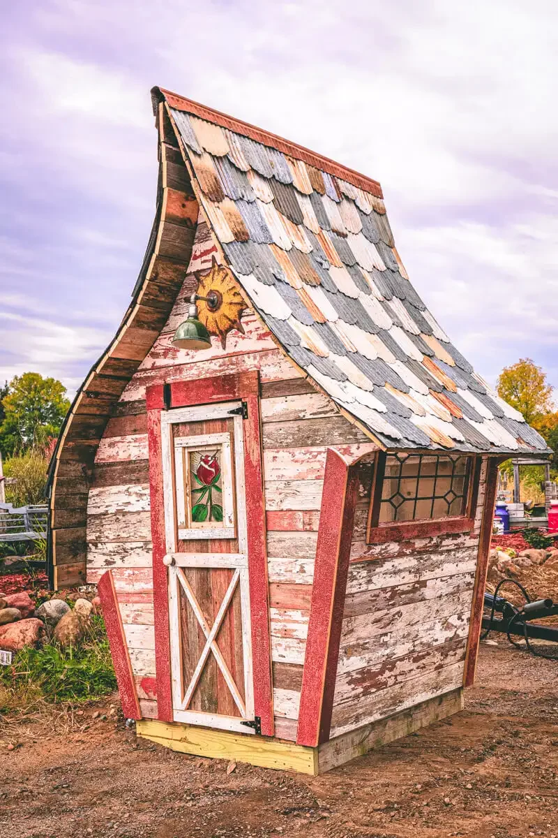 whimsical-garden-shed-barnwood.webp