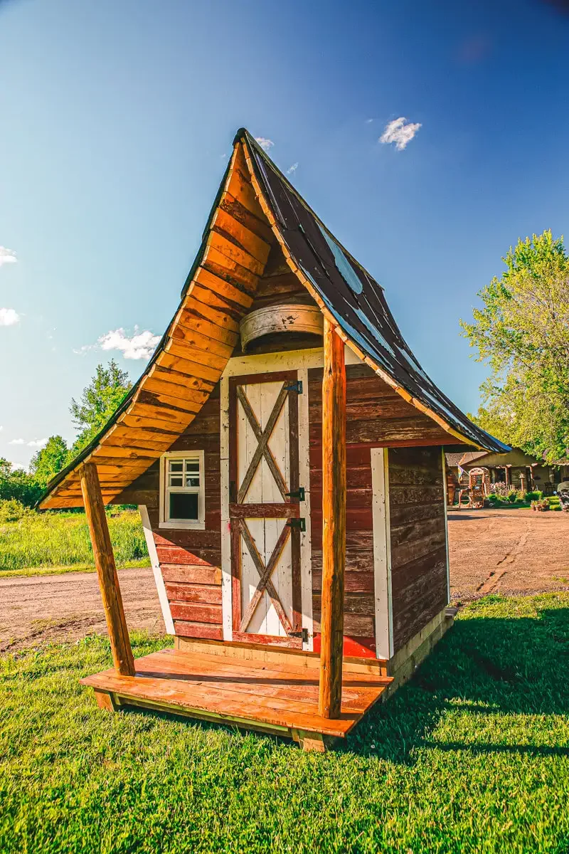 whimsical-garden-shed-reclaimed-wood.webp