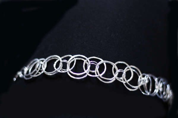 Sterling silver chain maille bracelet. The bracelet is made up of individually hand made rings with a hammered finish - giving a beautiful light reflecting effect.
