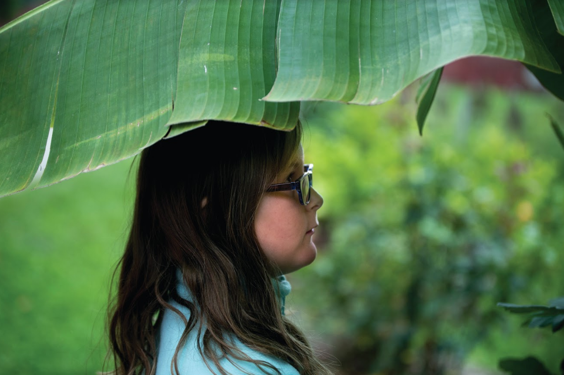 Ella poses for a portrait at a cherry orchard in Crooksville, Ohio.
