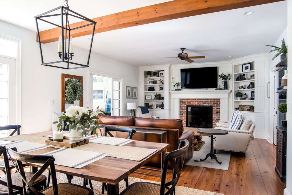 Hartzske_Family room with white walls and wood ceiling beams.jpg