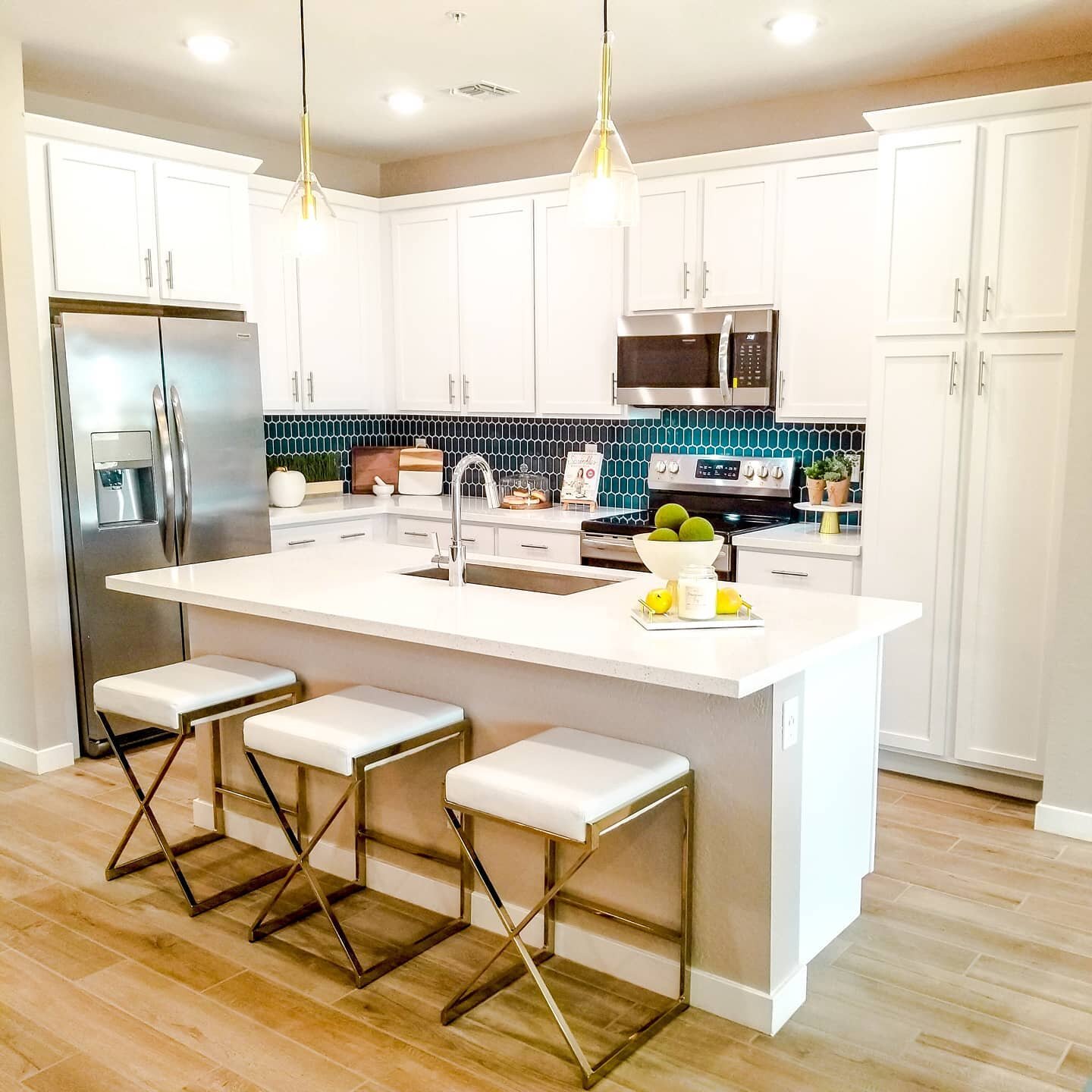 Getting some #kitcheninspo from my new build tour today. I love love LOVE the dark teal tile backsplash, but our granite countertops may be too busy for that. Subway tile is such an easy way to go and still looks clean and modern. What do you think? 