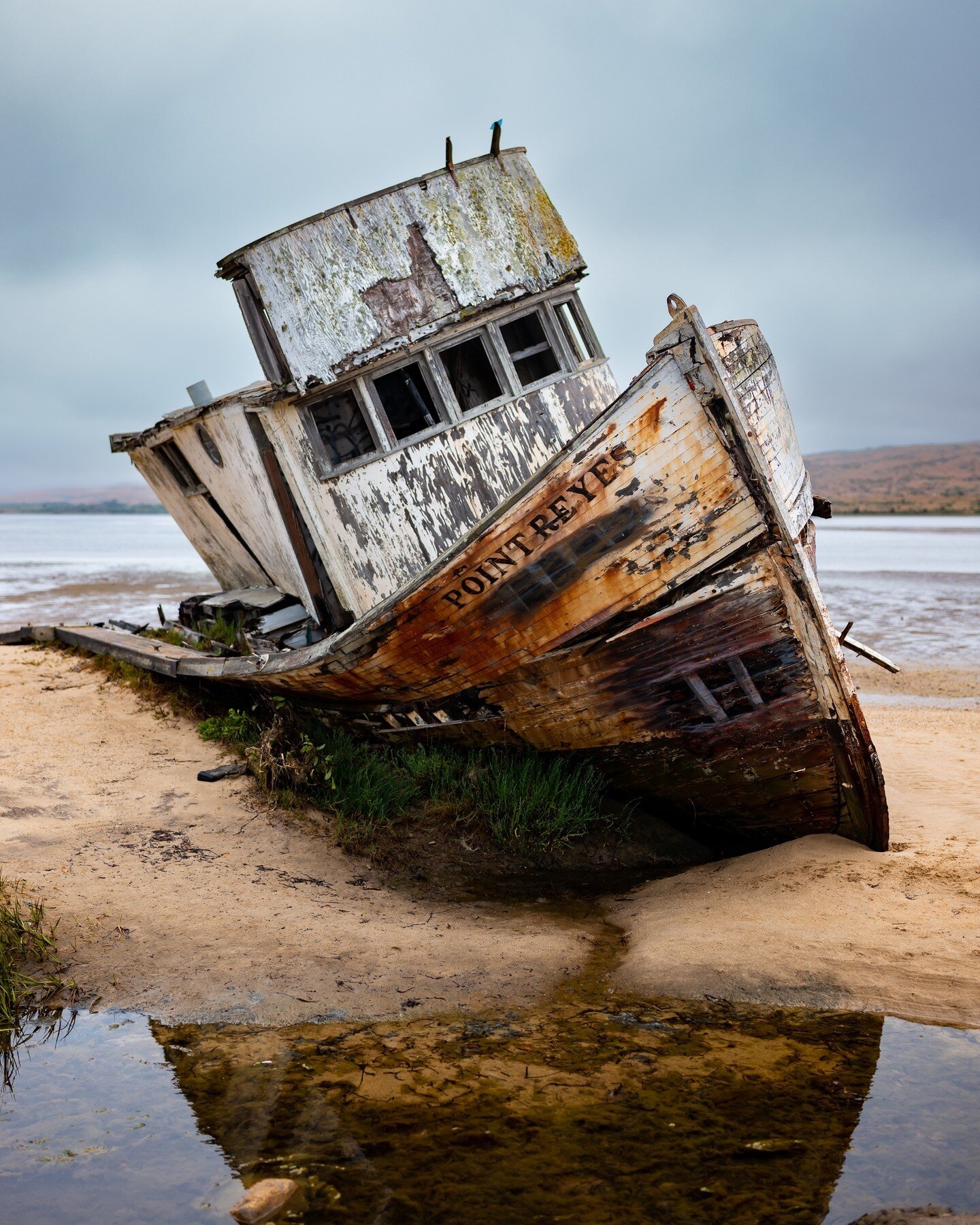 Sitting derelict on a lonely shoreline in California is an old boat from the early 1900s. Legend has it that it was pulled ashore to have some work done, but life has a habit of getting in the way of even best laid plans, and the boat today belongs t