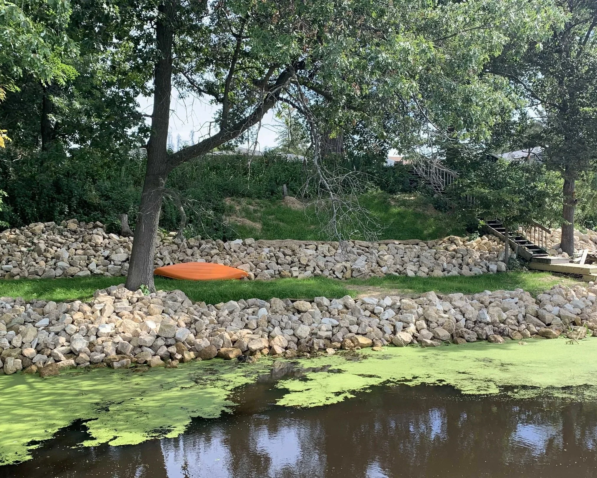 Shoreline with rip rap installed in La Crosse WI